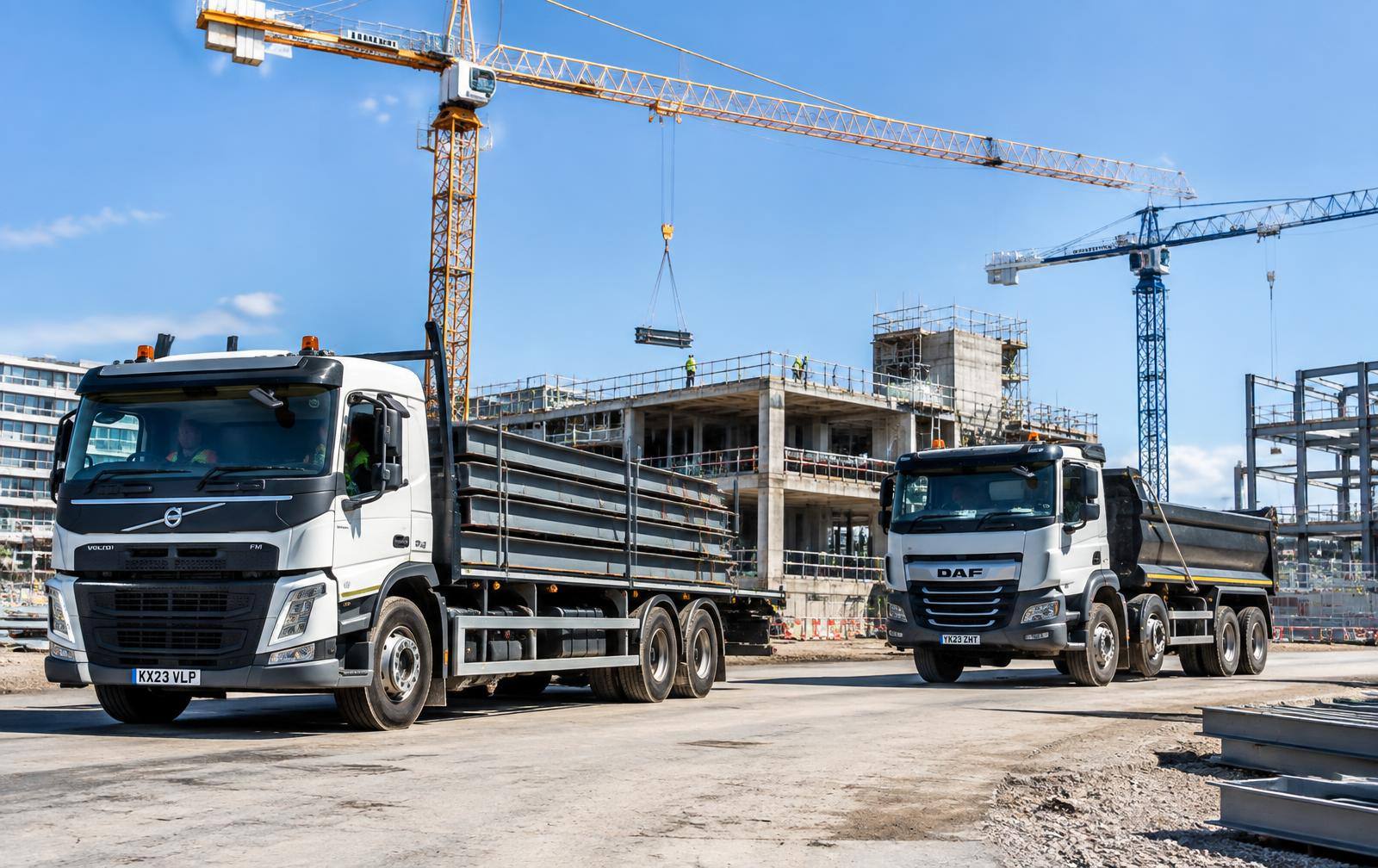 Trucks delivering steel to a construction site